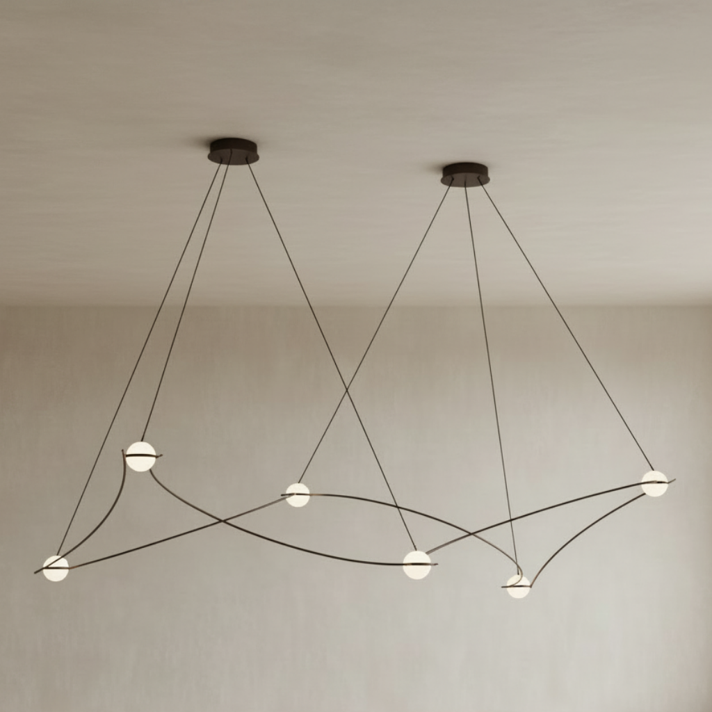 A modern multi-light linear chandelier with two suspended cone-shaped heads, thin black cords, and small gold-toned end caps, shown on a plain white background.