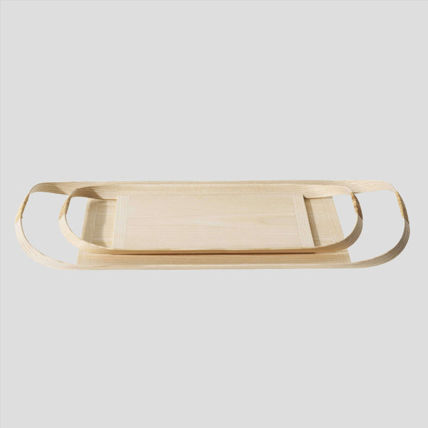 Small wooden tray placed on top of large wooden tray
