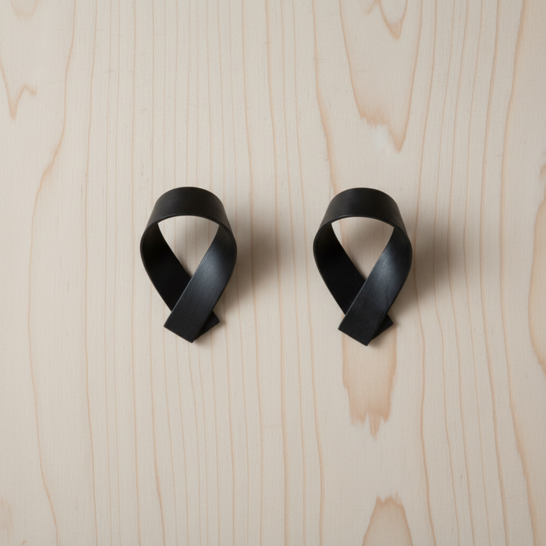 RIBBON hooks by Motarasu on pale Douglas Fir wall