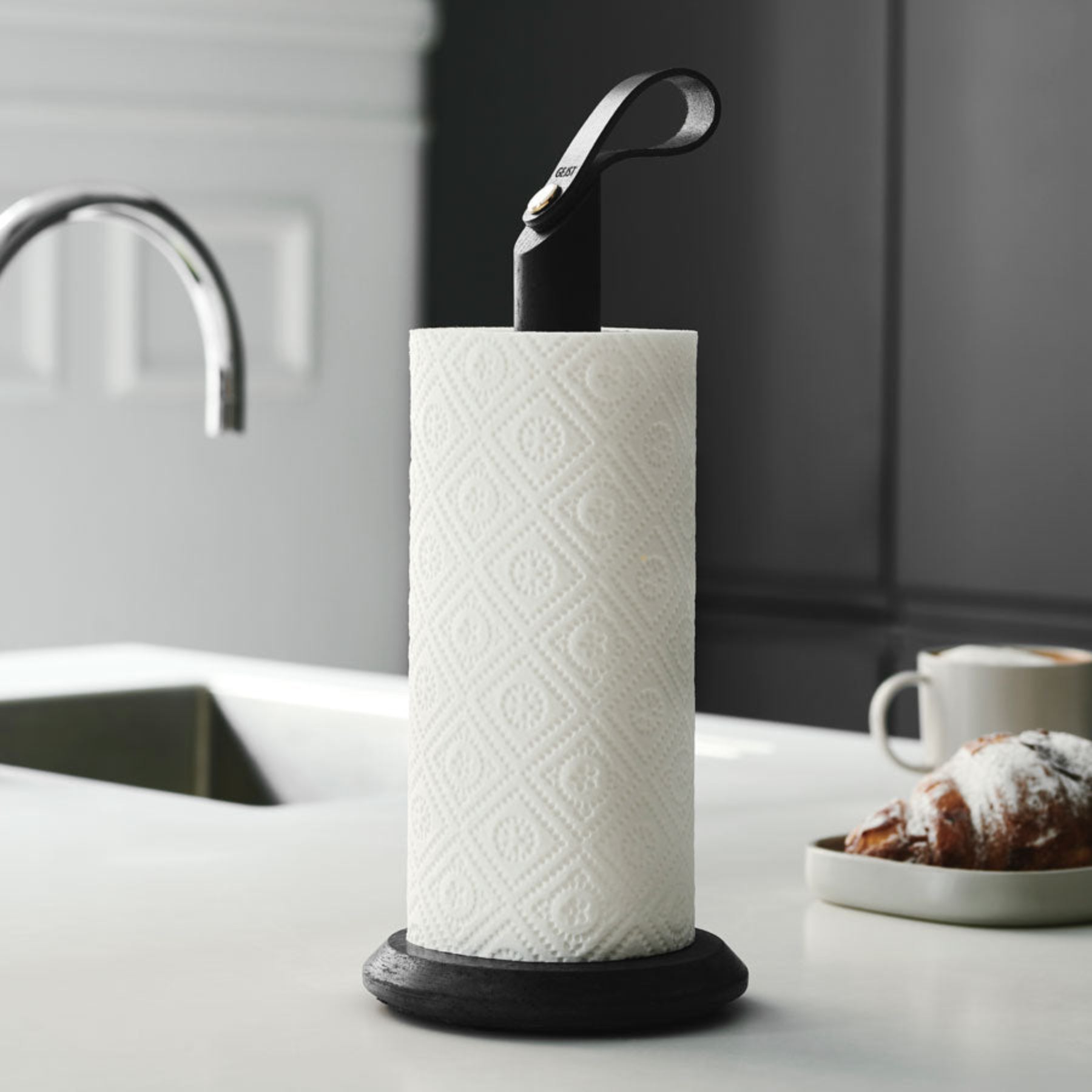 Grab Paper Towel Holder - Black solid oak wood, leather loop with poured concrete base has Nordic look.  This Scandinavian designed elegant paper towel holder from  is a bestselling item by Gejst Denmark.
