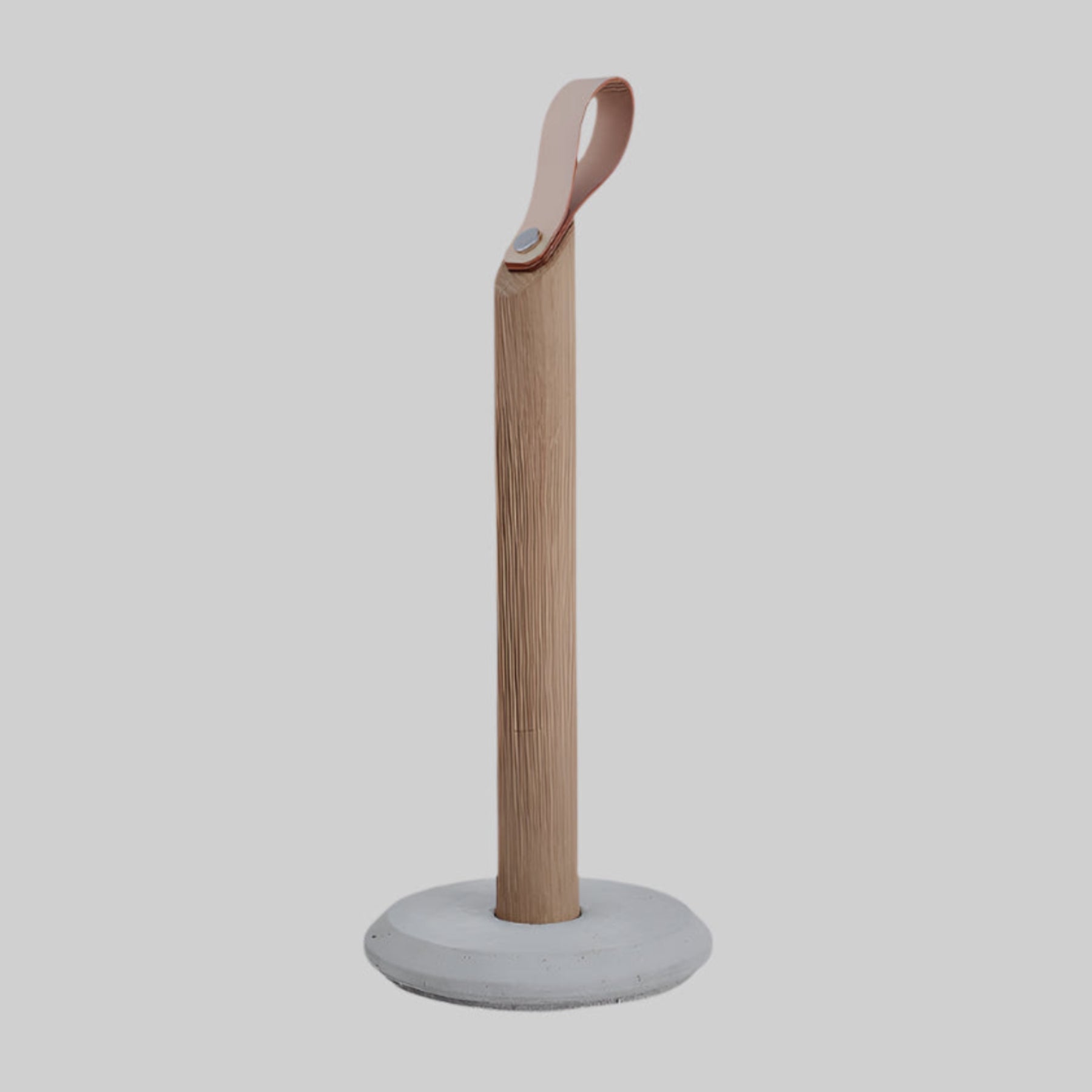 Grab Paper Towel Holder - solid oak wood, leather loop with poured concrete base has Nordic look.  This Scandinavian designed elegant paper towel holder from  is a bestselling item by Gejst Denmark.