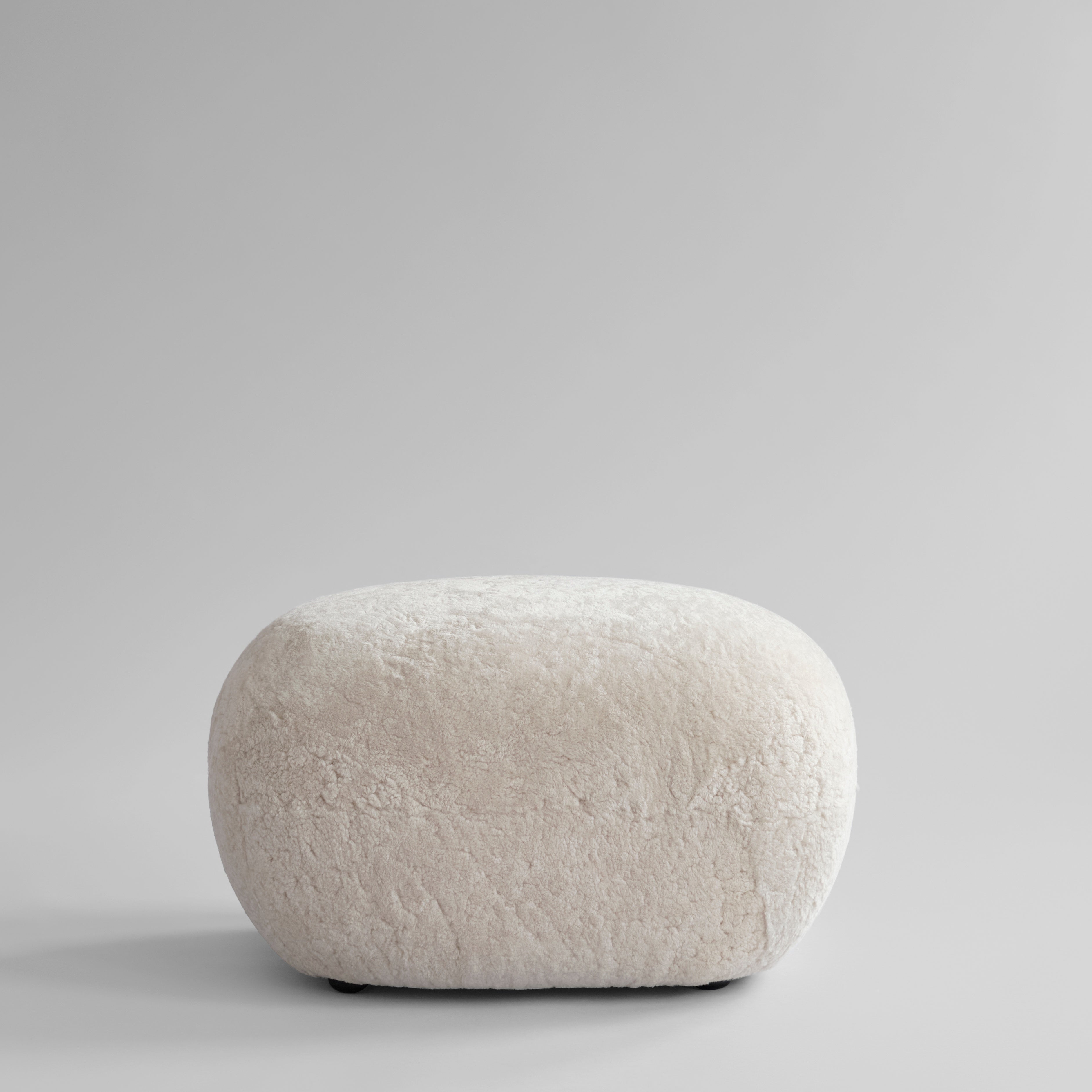 Toe Ottoman - Sandshell Sheepskin*