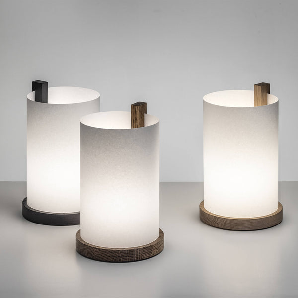 Set of three paper table lamps placed together, lights on