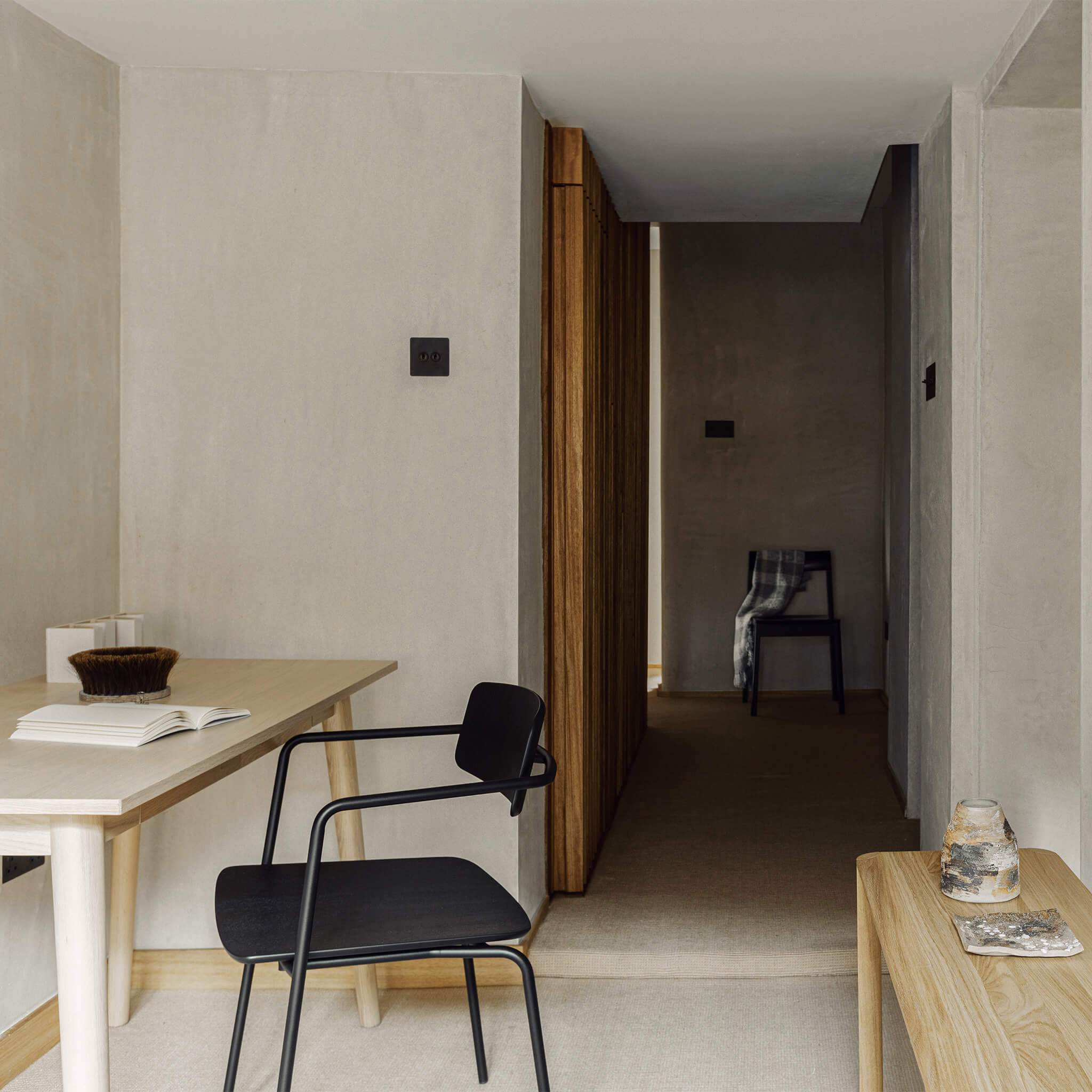 Dining chair with open back, placed in a study room