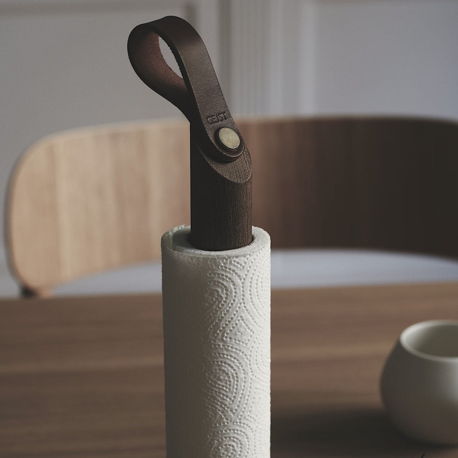 Grab Paper Towel Holder - solid oak wood, leather loop with poured concrete base has Nordic look.  This Scandinavian designed elegant paper towel holder from  is a bestselling item by Gejst Denmark.