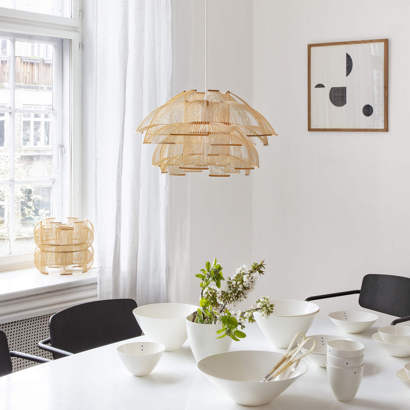 Bamboo pendant light placed above the dining table