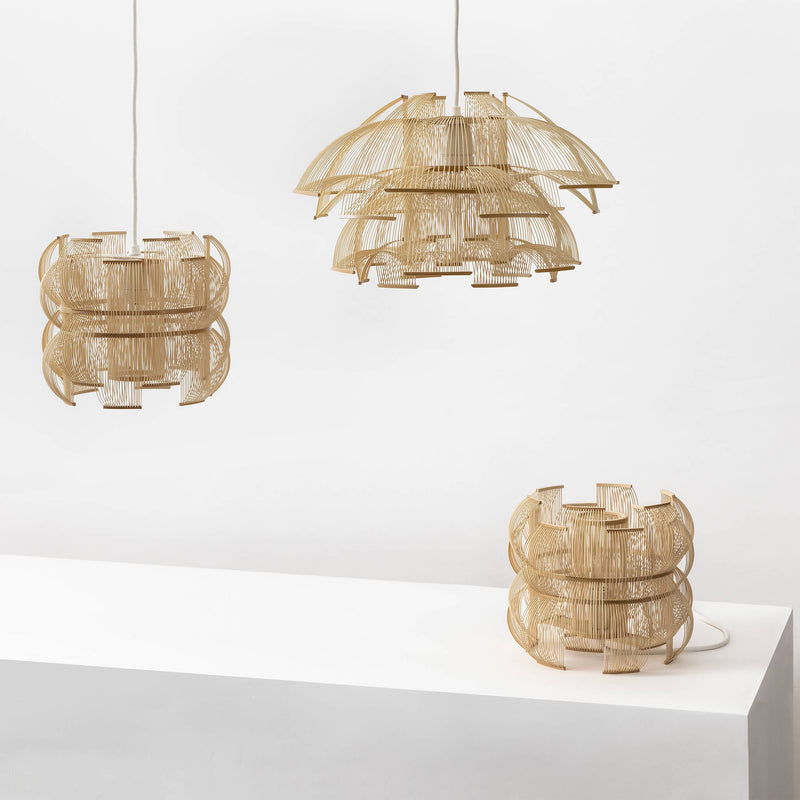 Collection of two bamboo pendant lights and bamboo table lamp