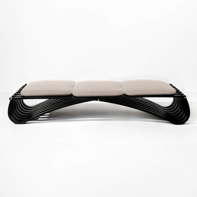 Black wooden daybed with three beige textile cushions, front view