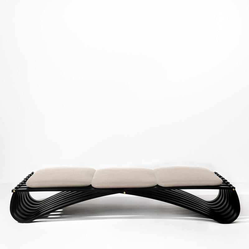 Black wooden daybed with three beige textile cushions, front view