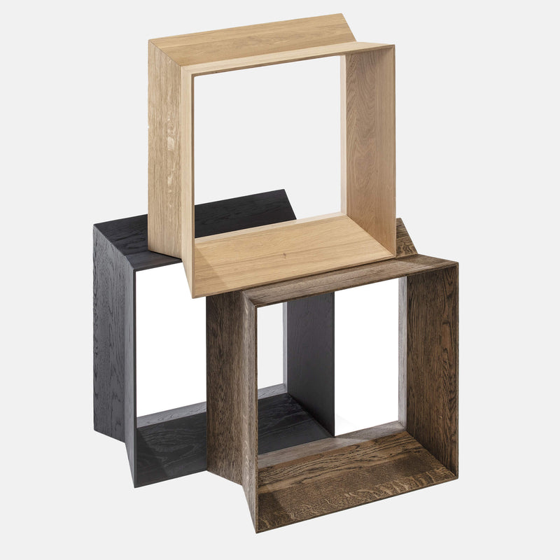 Three oak stools together, one placed on top of the other two