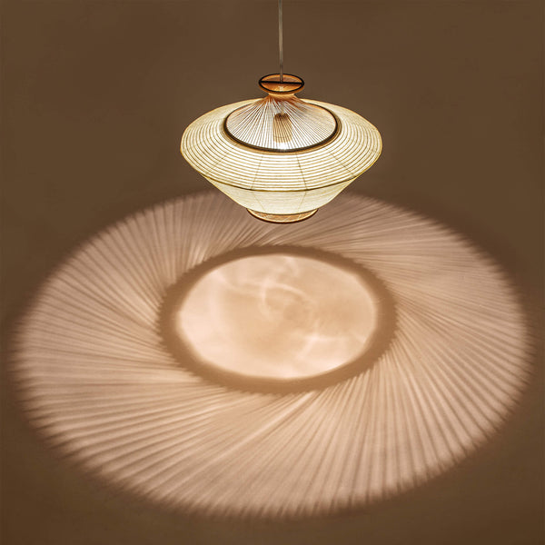 Pendant light made of bamboo and paper, showcasing the shadow it casts