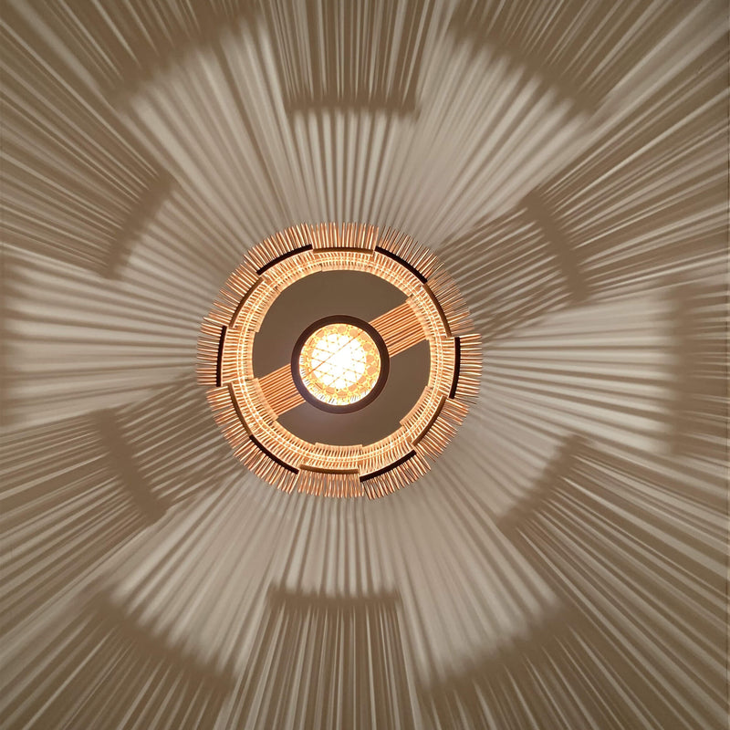 Bamboo pendant light, bottom view with the light on