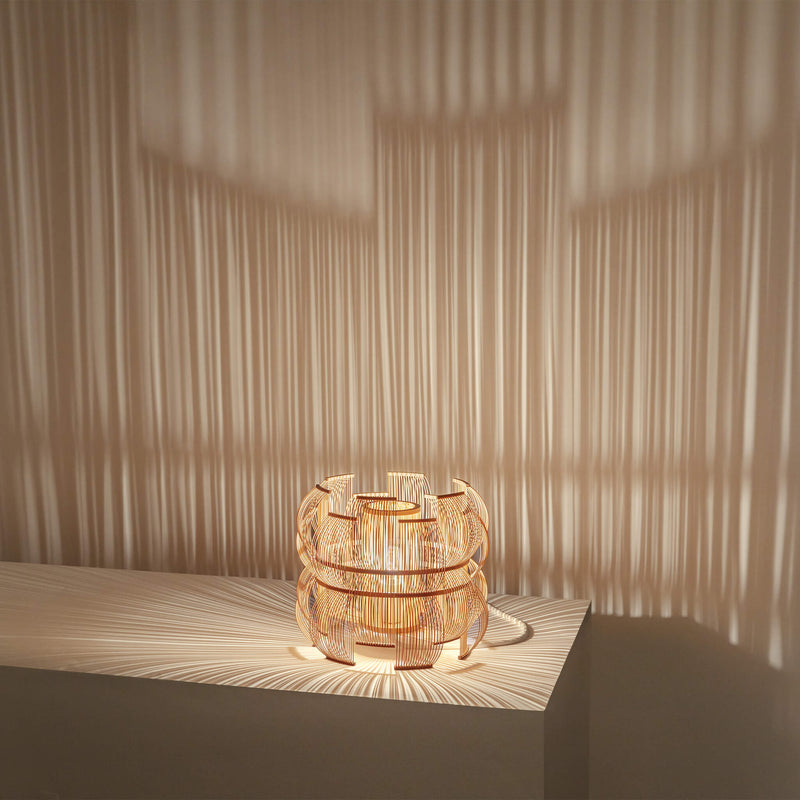 Bamboo table lamp and the lightshow it creates on the wall behind it