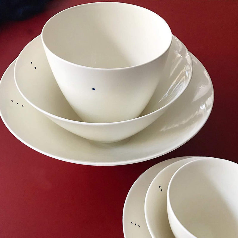 Set of porcelain bowls stacked on top of each other