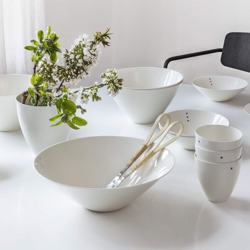 Set of porcelain bowls placed on a dining table