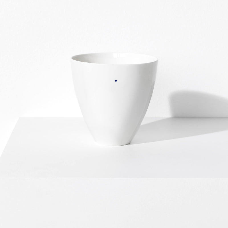 Large porcelain bowl featuring a design with one blue indigo dot