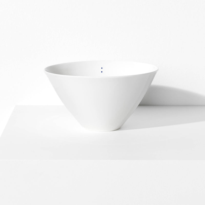 Large porcelain bowl featuring a design with two blue indigo dots