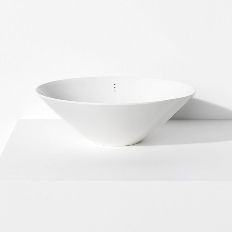 Large porcelain bowl featuring a design with three blue indigo dots