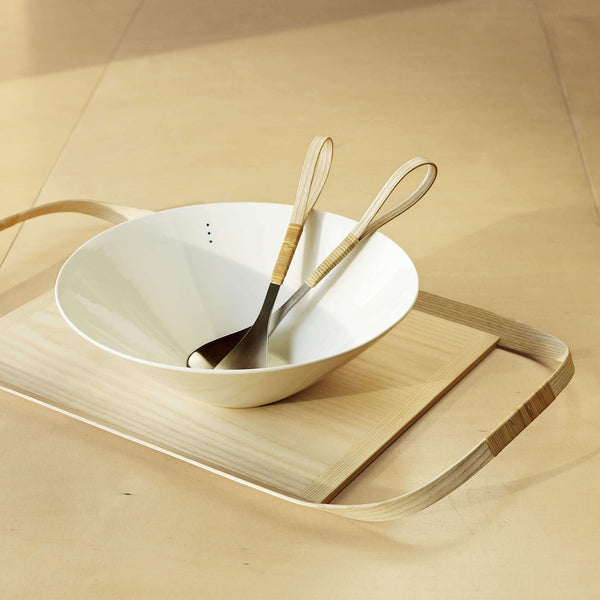 Wooden tray holding a porcelain bowl and salad cutlery