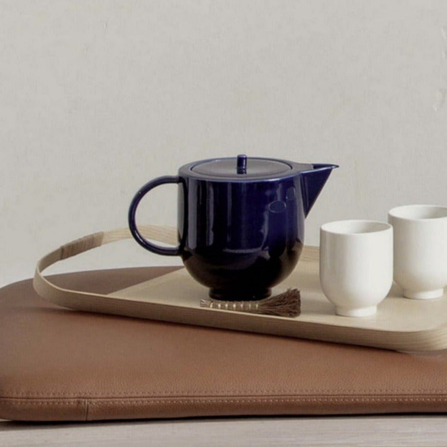Art Deco inspired teapot in blue with white porcelain cups on Japanese wood tray by Motarasu