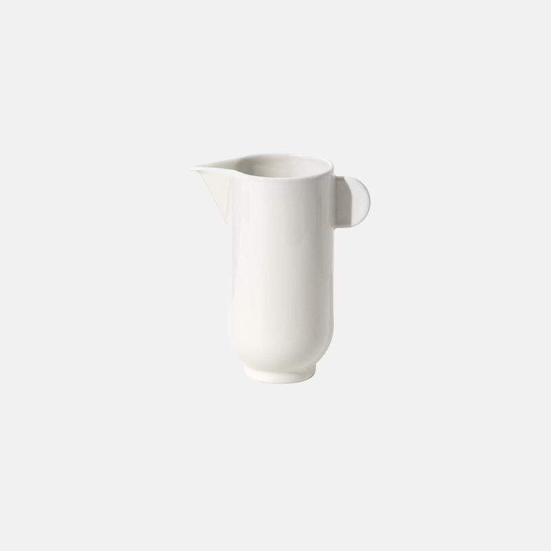 Porcelain tea pitcher with a small handle, side view