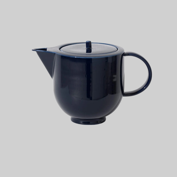 Navy blue porcelain blue with a shiny surface, side view