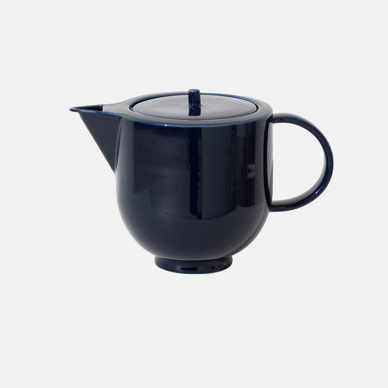 Navy blue porcelain blue with a shiny surface, side view