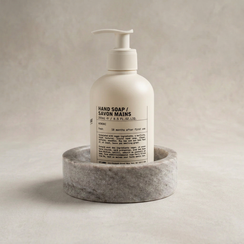 Enlarged soap dispenser narrowly fitting inside the marble base
