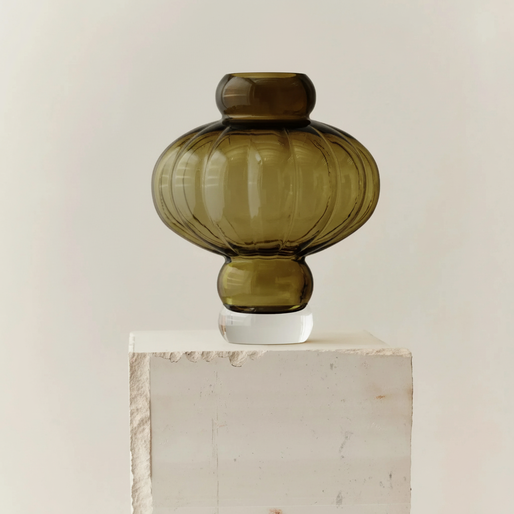 Olive green balloon glass vase on white pedestal