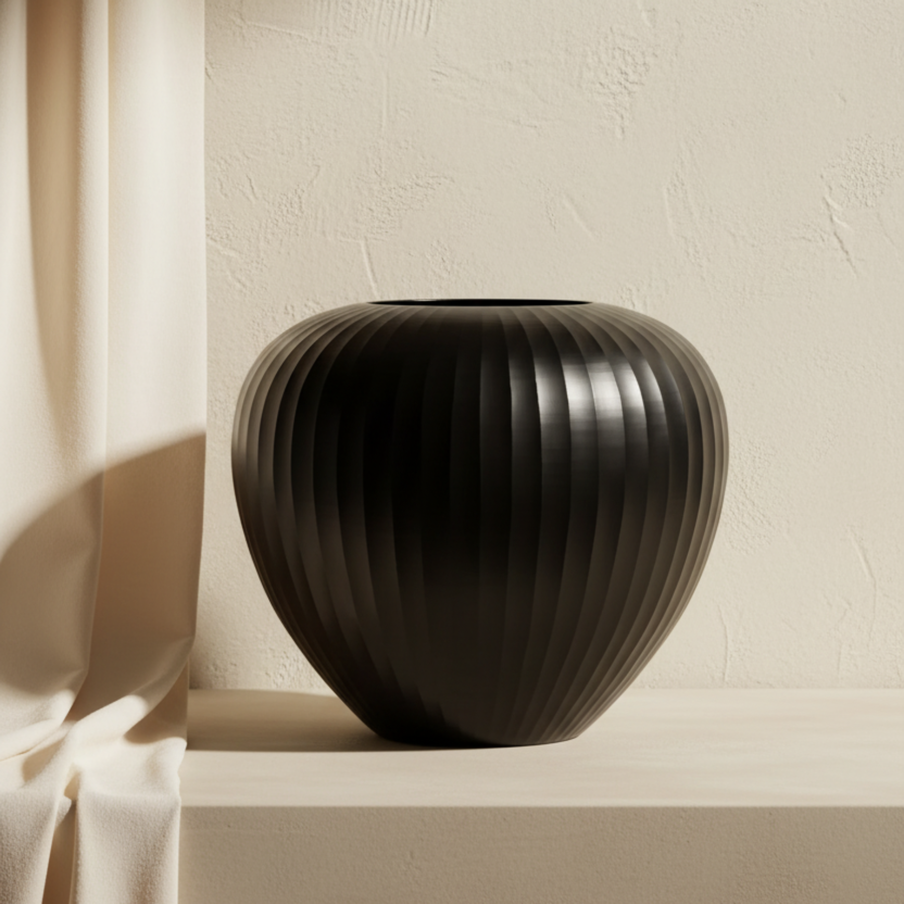 Organic Vase 06 - Black on cream limewash backdrop with ivory drape