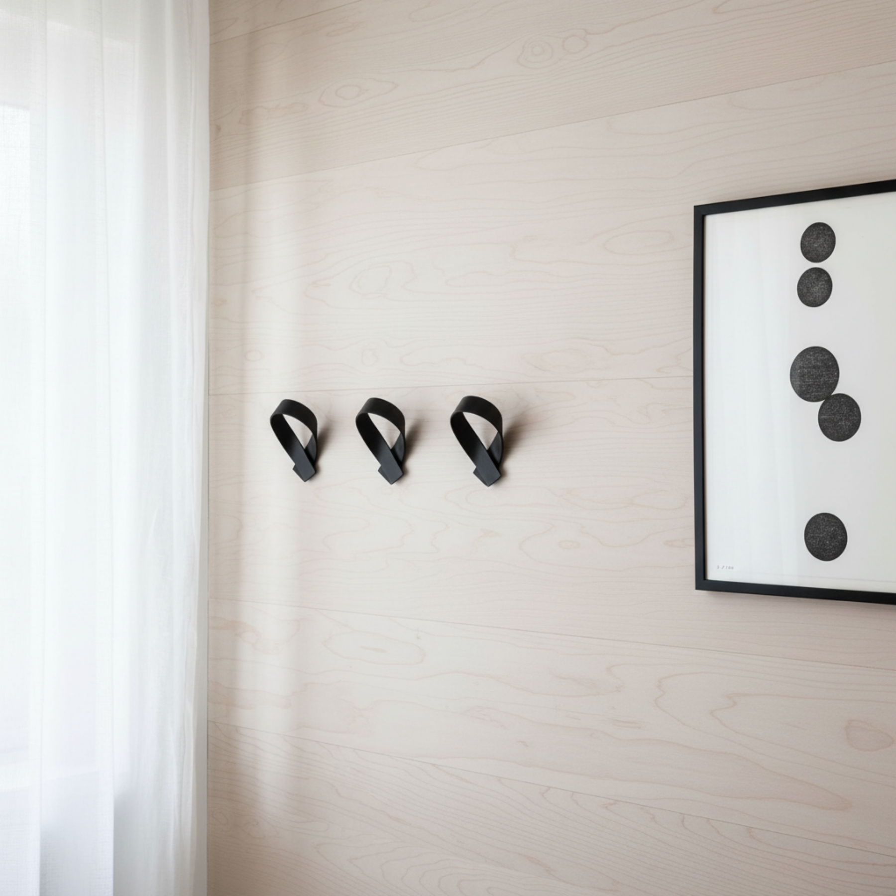 RIBBON hooks 3/4 angle view on pale Douglas Fir wall