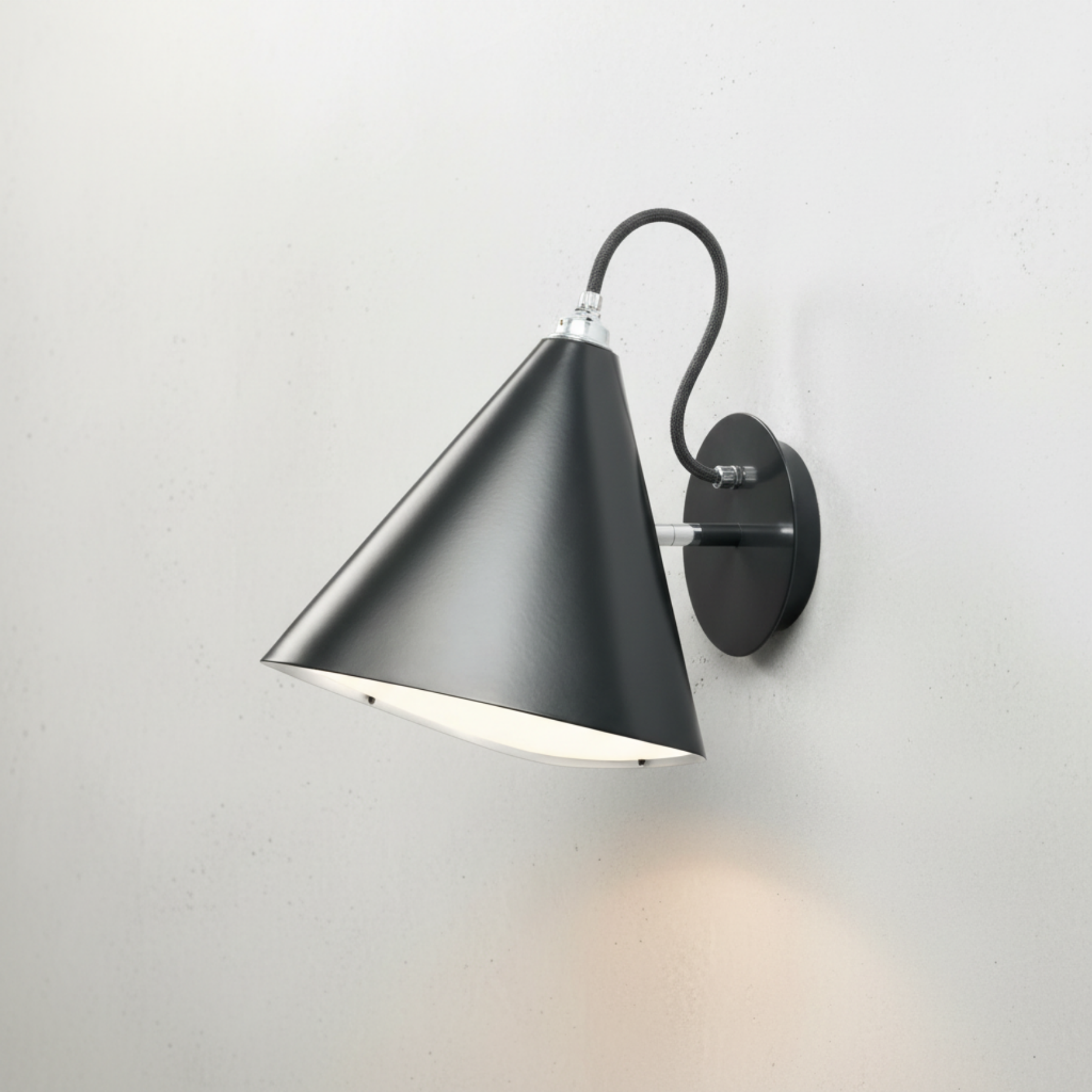 Wall sconce product image with light grey mottled background