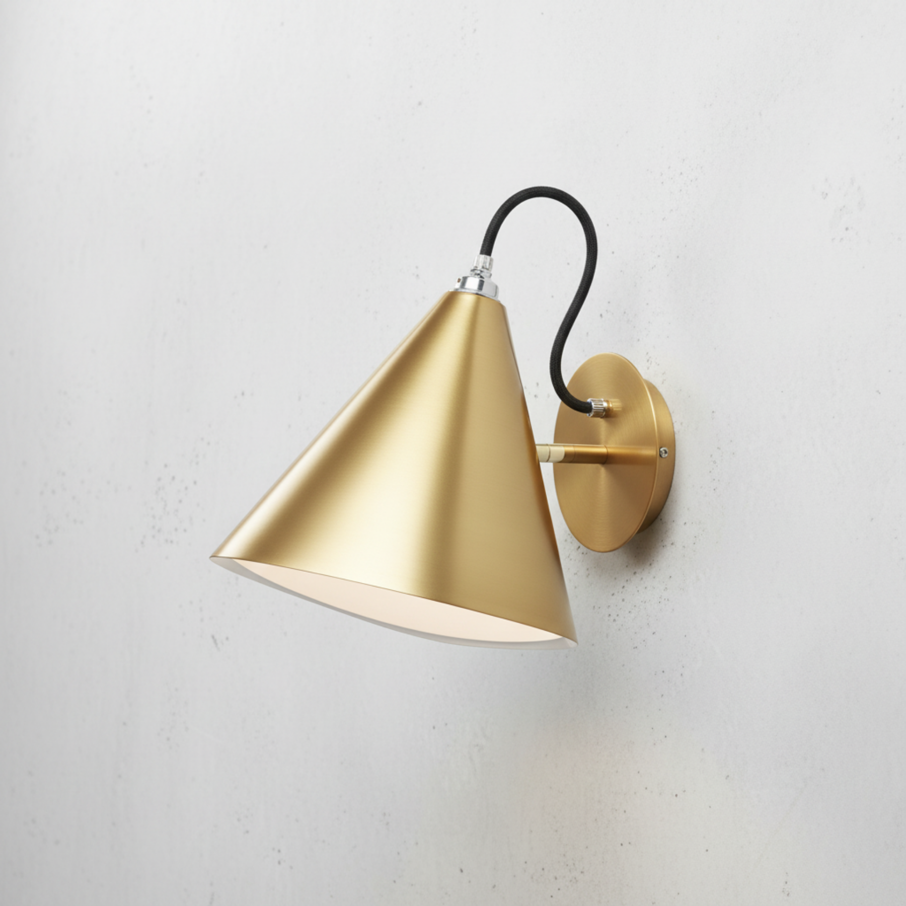 Wall sconce with satin brass gold shade and canopy, black cord