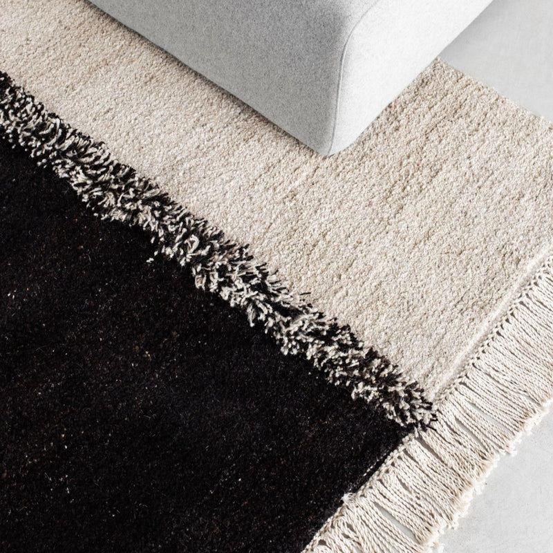 Sera Helsinki, Finnish designed hand-made rugs from Ethiopia, fair-trade, ethically made.  Available exclusively in  North America, Canada and USA, through Studio Nordhaven.  E-1027 knotted -  white + black