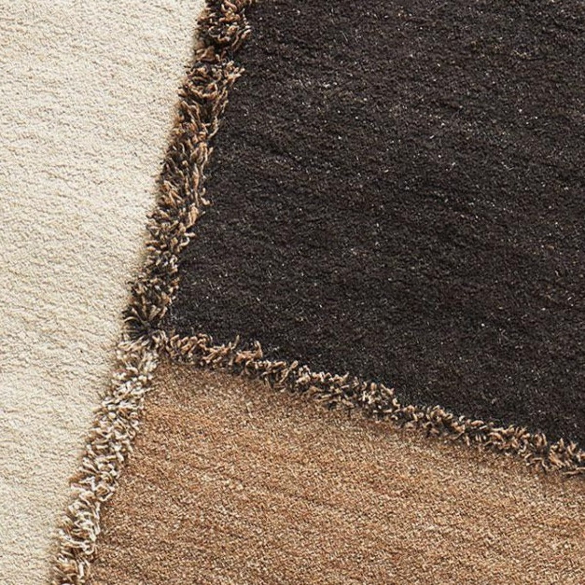 Sera Helsinki, Finnish designed hand-made rugs from Ethiopia, fair-trade, ethically made.  Available exclusively in  North America, Canada and USA, through Studio Nordhaven.  E-1027 knotted -  white, brown + black