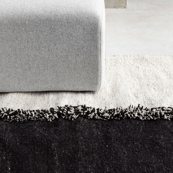 Sera Helsinki, Finnish designed hand-made rugs from Ethiopia, fair-trade, ethically made.  Available exclusively in  North America, Canada and USA, through Studio Nordhaven. E-1027 Hand Woven Rug - White + Black
