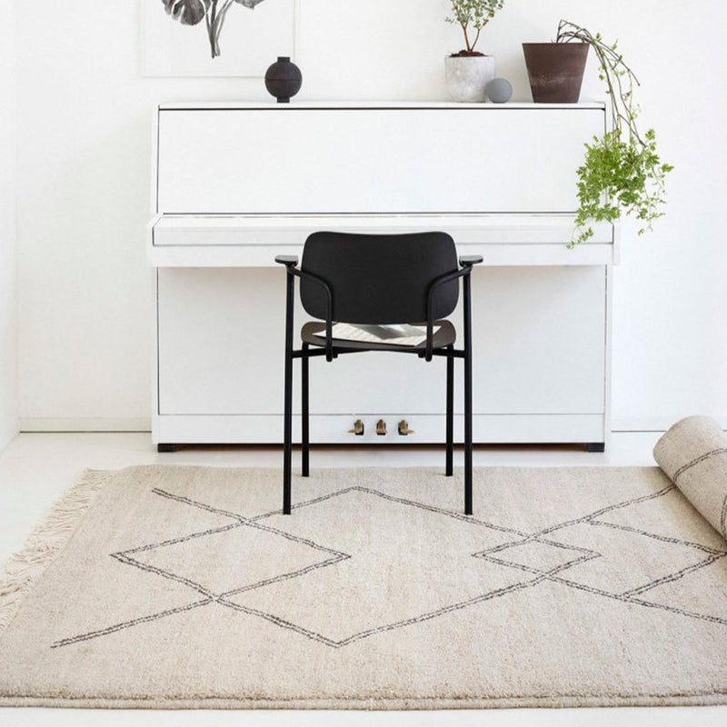 Sera Helsinki, Finnish designed hand-made rugs from Ethiopia, fair-trade, ethically made.  Available exclusively in  North America, Canada and USA, through Studio Nordhaven. Kide black & white wool rug - Juuret Collection