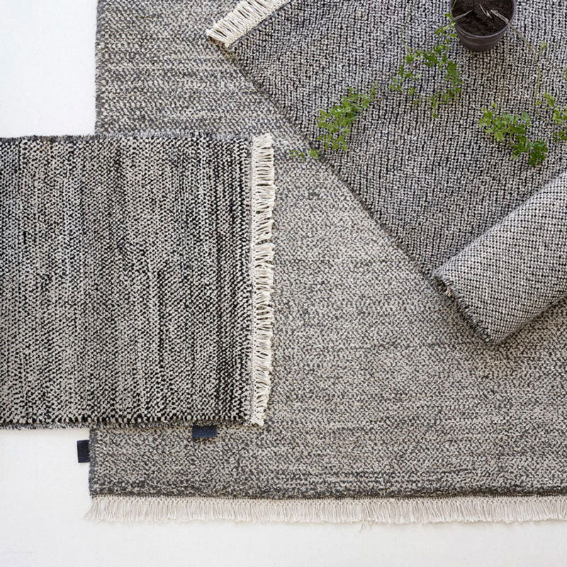 Sera Helsinki, Finnish designed hand-made rugs from Ethiopia, fair-trade, ethically made.  Available exclusively in  North America, Canada and USA, through Studio Nordhaven. Tuohii Knotted Wool Rug - White + Black - Juuret Collection