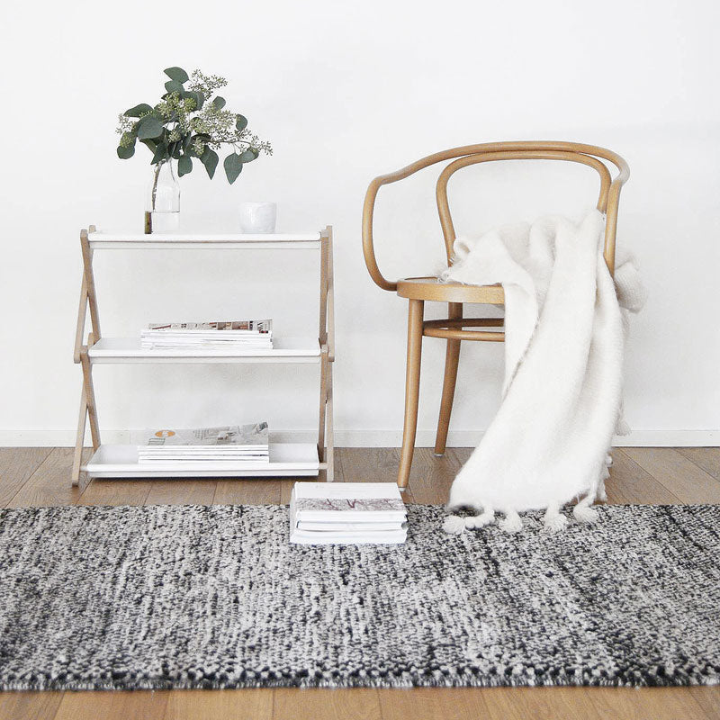 Sera Helsinki, Finnish designed hand-made rugs from Ethiopia, fair-trade, ethically made.  Available exclusively in  North America, Canada and USA, through Studio Nordhaven. Tuohii Knotted Wool Rug - White + Black - Juuret Collection